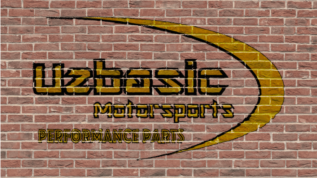 Uzbasic Motorsports logo on brick wall